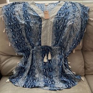 Brand New Blue swimsuit coverup with lace collar and tassels on sides.